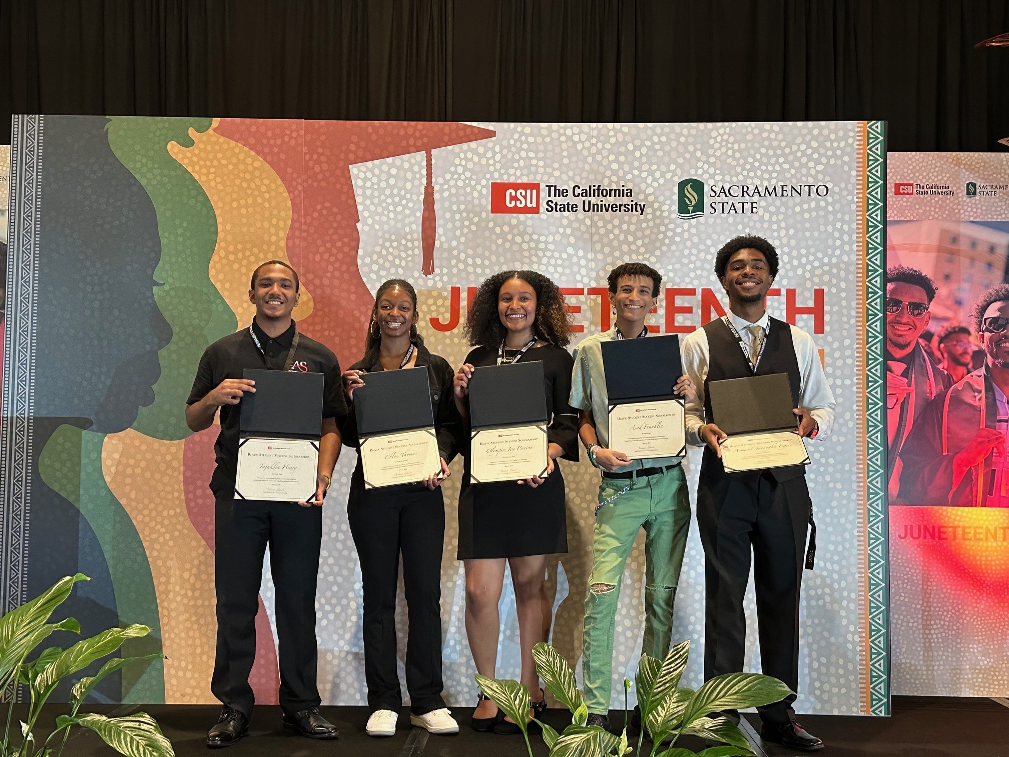 (From left to right) CSU Black Student Success scholars from the CSU Juneteenth Symposium that took place in Sacramento on June 13 and 14. Tajuddin Henry, San Diego State, Chloe Thomas, Cal State Long Beach, Olympia Joy Pereira, San Francisco State, Asad Franklin, Sonoma State, and Armand Jovaughn Egere, CSU Dominguez Hills. (Not pictured: Aliyshah Shamburger, Cal State San Bernardino)